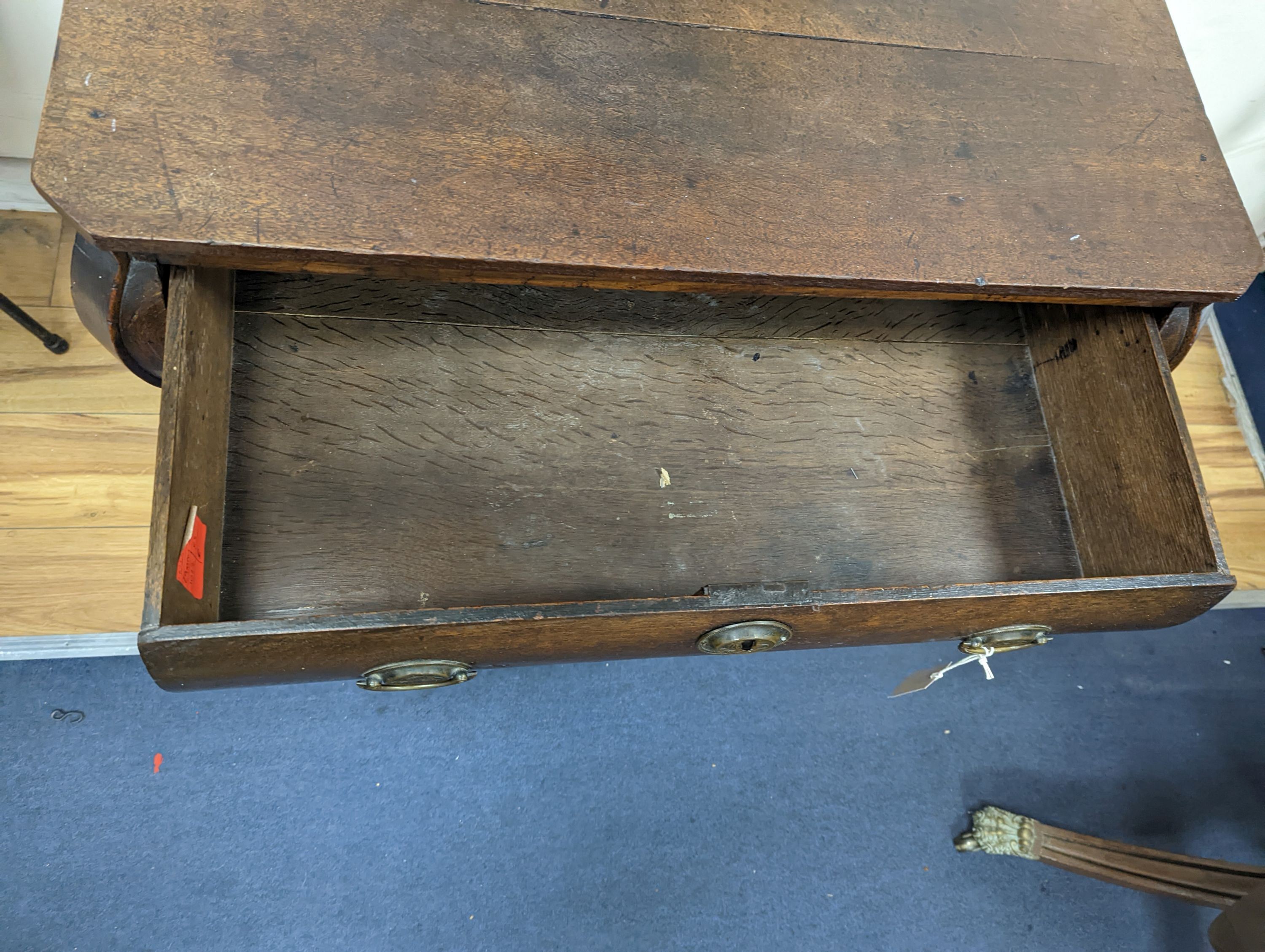 An 18th century Dutch oak three drawer bombe chest, width 94cm, depth 50cm, height 76cm